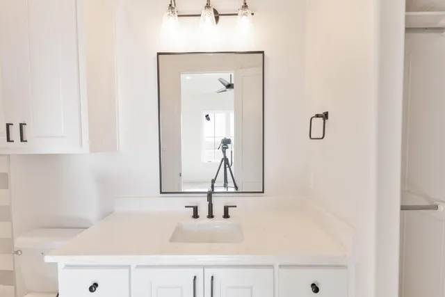 a bathroom with a sink and a mirror