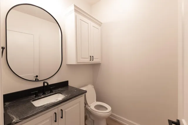 a bathroom with a double vanity sink and mirror