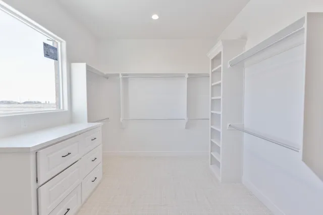a spacious bathroom with a bathtub sink and mirror