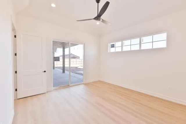 a bathroom with a bathtub and a chandelier