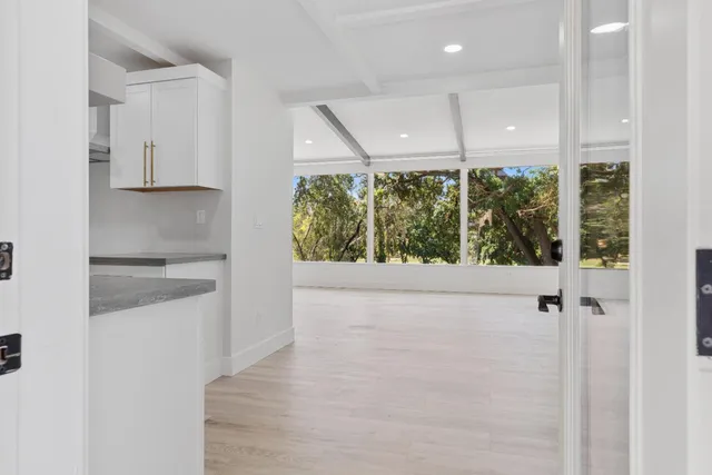 a view of a kitchen with a sink and dishwasher
