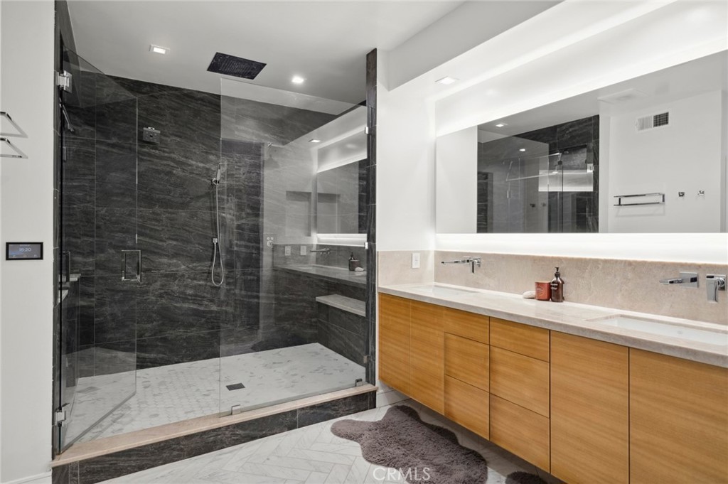 3 Bridgeport Road Newport Coast, CA 92657 - Photo 24 of 25 a bathroom with a shower sink and mirror