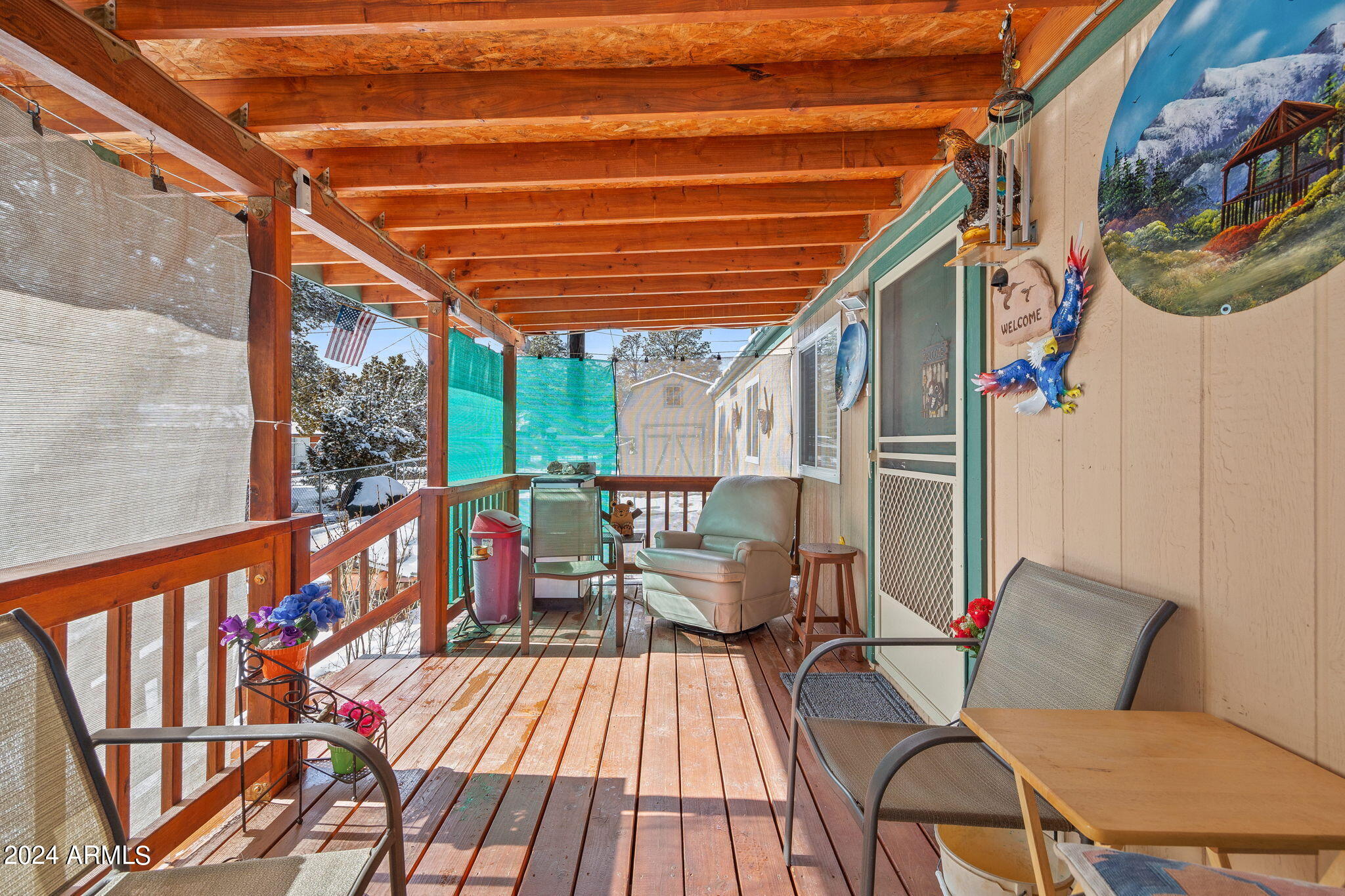 3512 Quail Run Road Overgaard, AZ 85933 - Photo 5 of 30 a balcony with wooden floor