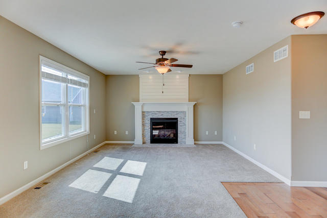 2003 Rylan Road Mahomet, IL 61853 - Photo 12 of 41 an empty room with windows and fireplace