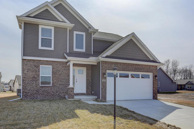 2003 Rylan Road Mahomet, IL 61853 - Photo 2 of 41 a front view of a house with a yard