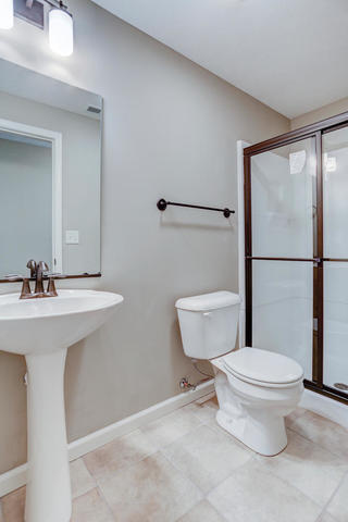 2003 Rylan Road Mahomet, IL 61853 - Photo 34 of 41 a bathroom with a sink toilet and shower