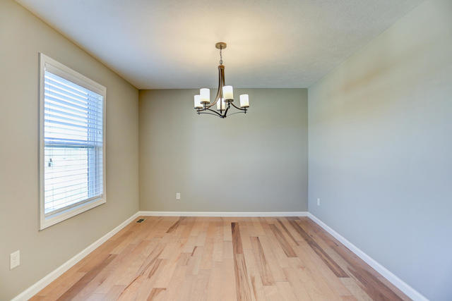 2003 Rylan Road Mahomet, IL 61853 - Photo 4 of 41 a view of empty room with wooden floor and fan