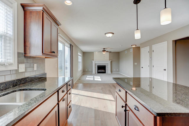 2003 Rylan Road Mahomet, IL 61853 - Photo 8 of 41 a kitchen with kitchen island granite countertop a sink and center island