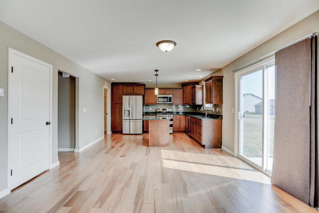 2003 Rylan Road Mahomet, IL 61853 - Photo 10 of 41 a kitchen with stainless steel appliances granite countertop a refrigerator and a sink