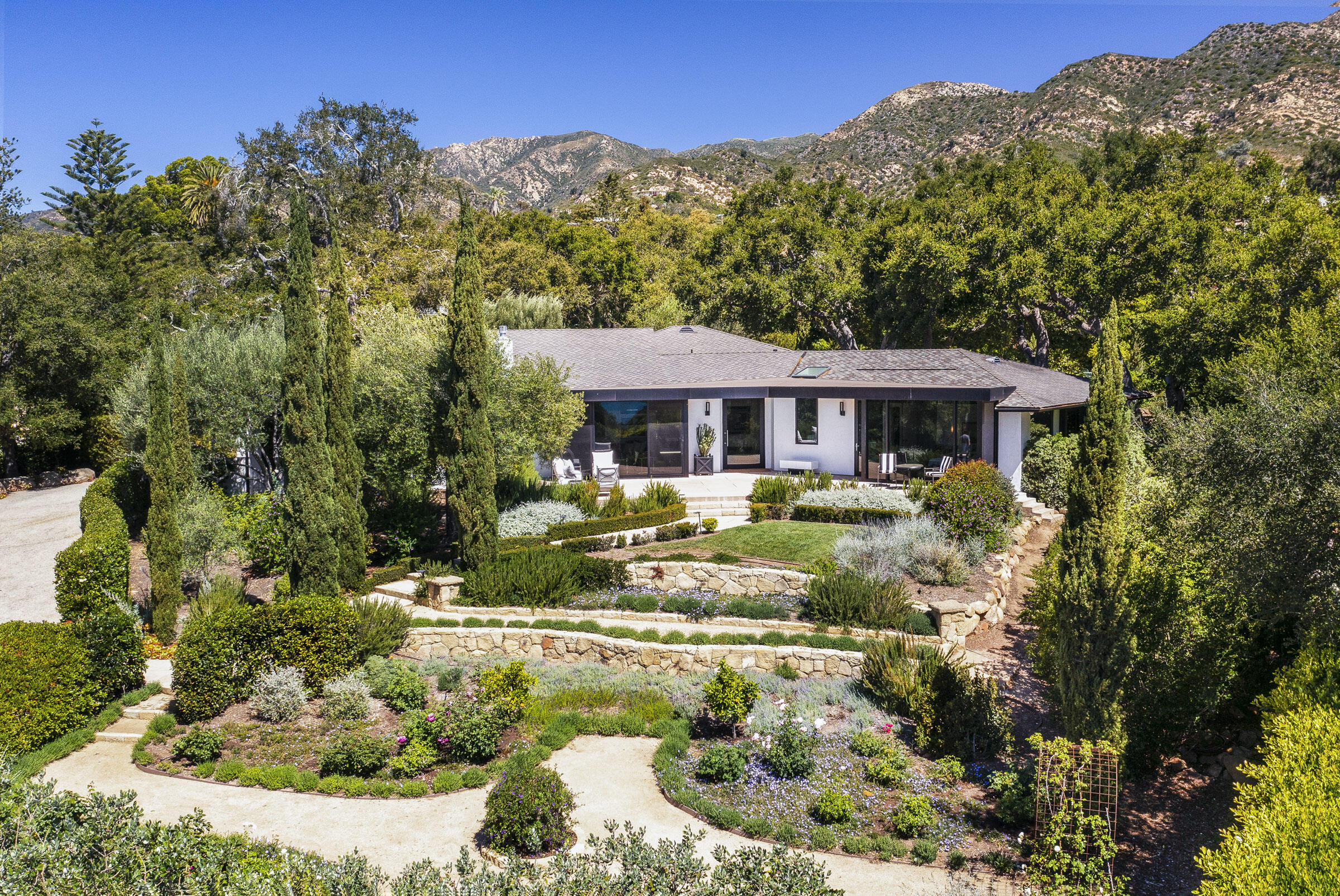 800 Hot Springs Road Montecito, CA 93108 - Photo 1 of 22 a view of a house with a yard and sitting area