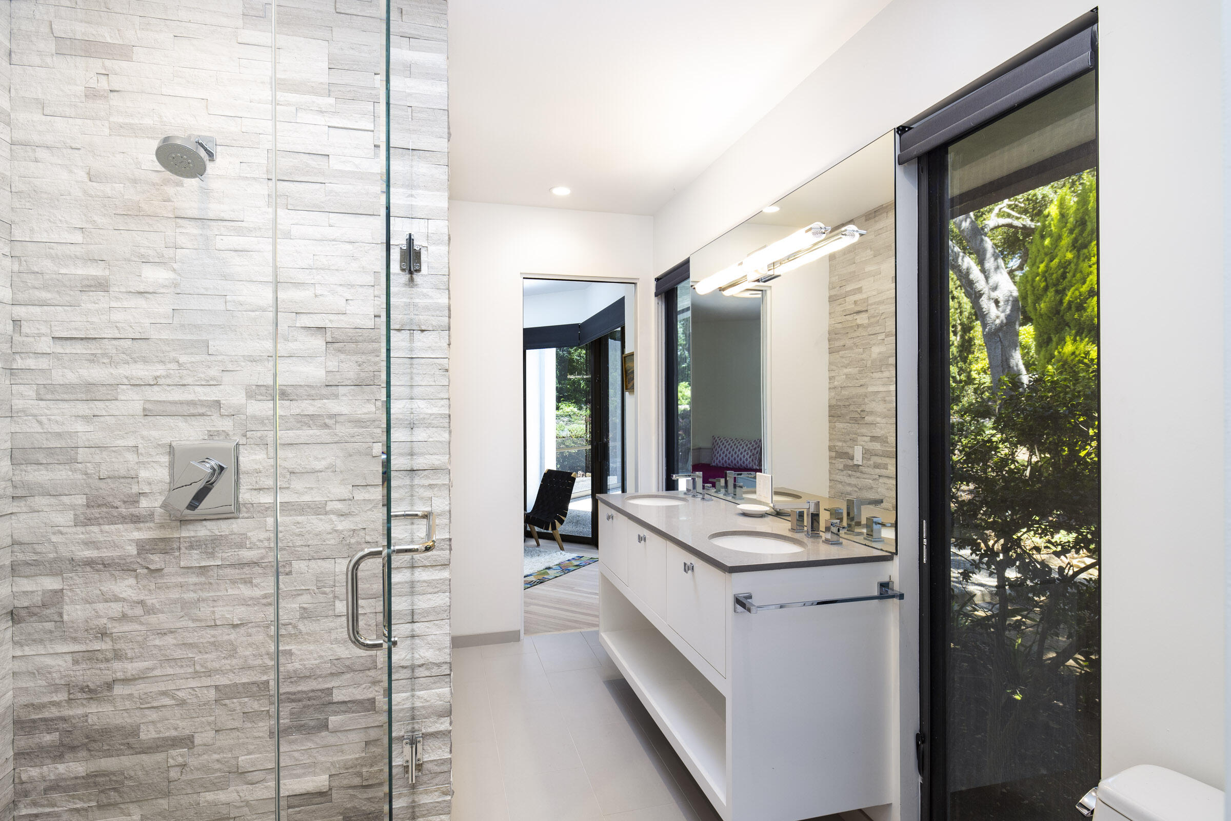 800 Hot Springs Road Montecito, CA 93108 - Photo 15 of 22 a bathroom with a double vanity sink and a mirror