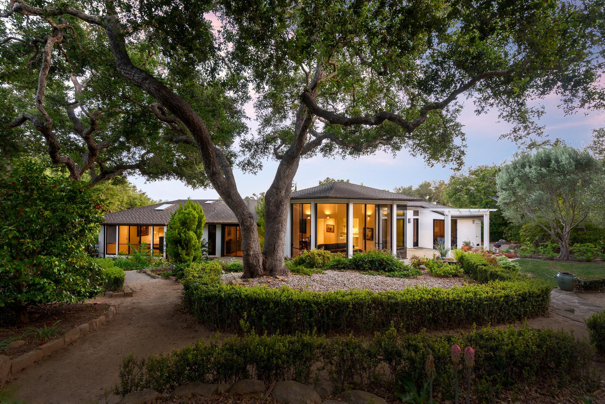 800 Hot Springs Road Montecito, CA 93108 - Photo 2 of 22 a front view of a house with a garden and trees