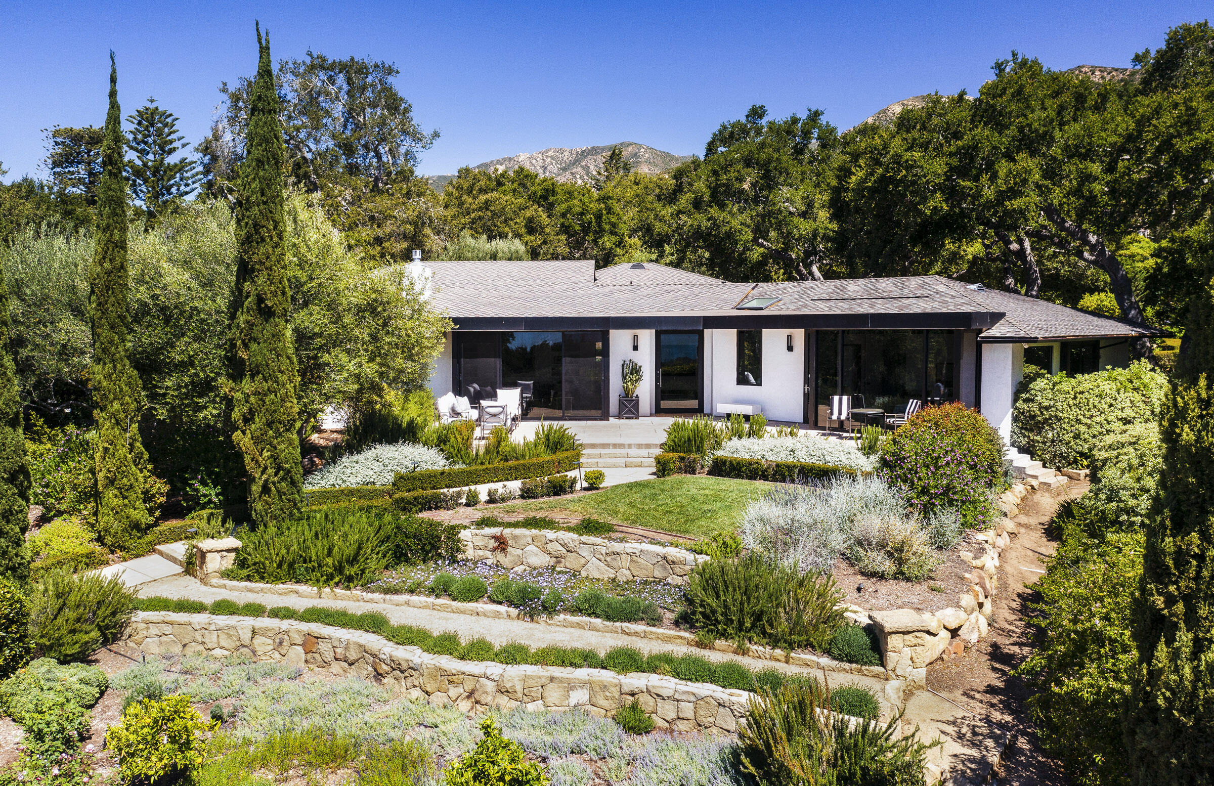 800 Hot Springs Road Montecito, CA 93108 - Photo 22 of 22 a front view of a house with a yard