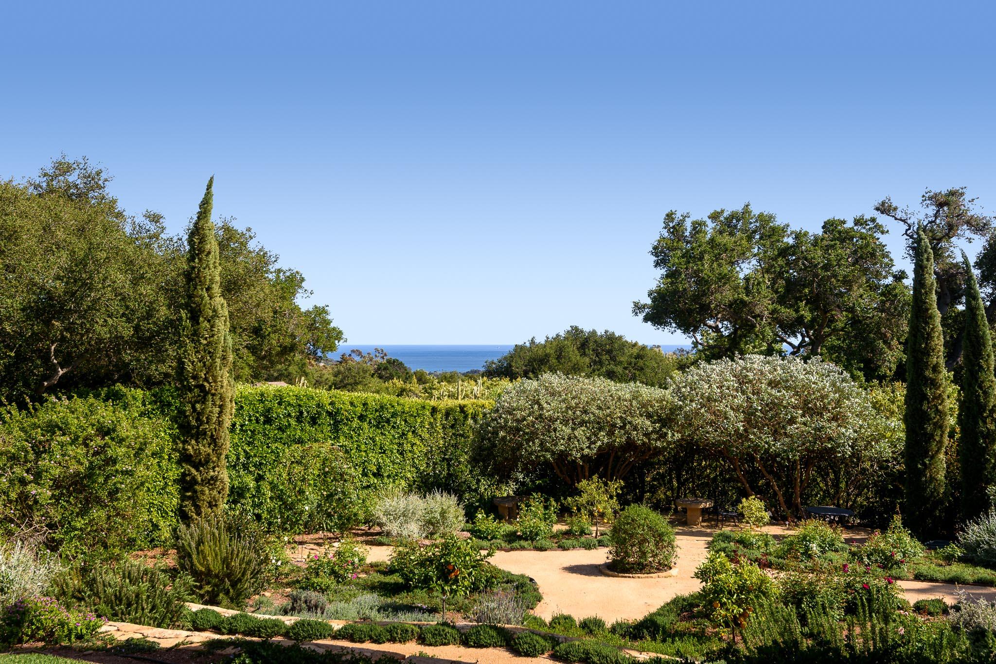 800 Hot Springs Road Montecito, CA 93108 - Photo 9 of 22 a view of a garden with a building in the background
