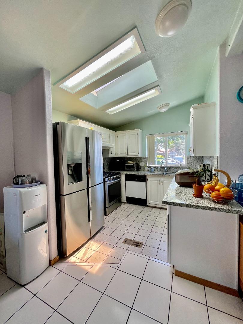 2600 Senter Road, Unit 261 San Jose, CA 95111 - Photo 3 of 12 a kitchen with stainless steel appliances granite countertop a refrigerator and a stove