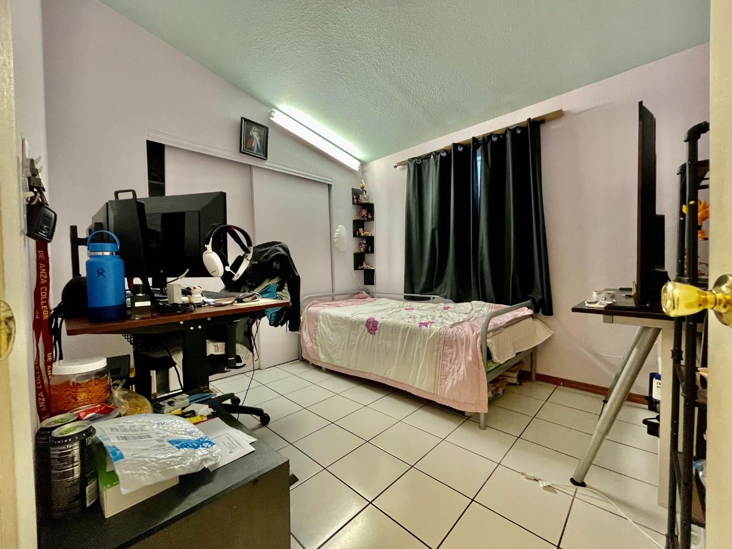 2600 Senter Road, Unit 261 San Jose, CA 95111 - Photo 6 of 12 a bedroom with furniture and natural light