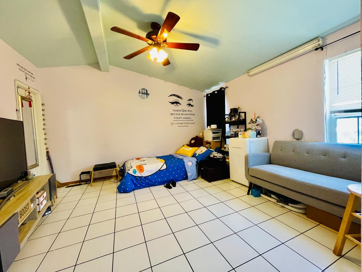 2600 Senter Road, Unit 261 San Jose, CA 95111 - Photo 8 of 12 a living room with furniture and a flat screen tv