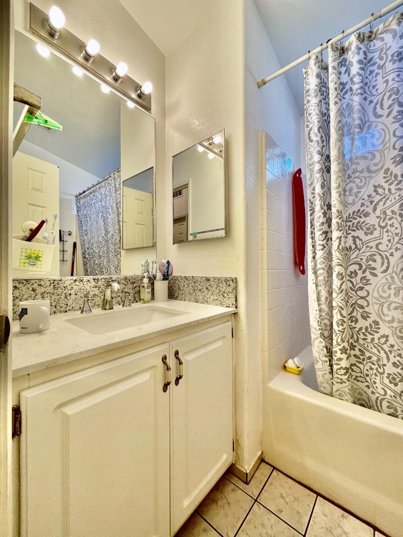 2600 Senter Road, Unit 261 San Jose, CA 95111 - Photo 9 of 12 a bathroom with a double vanity sink mirror and shower