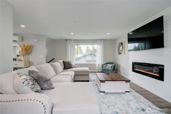 a bathroom with a toilet sink vanity and mirror