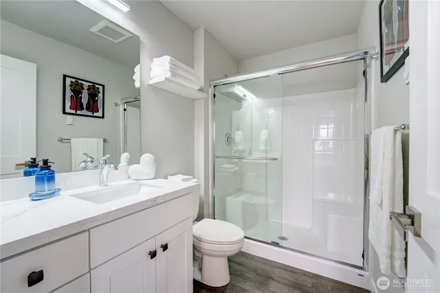 a bathroom with a shower and a shower curtain
