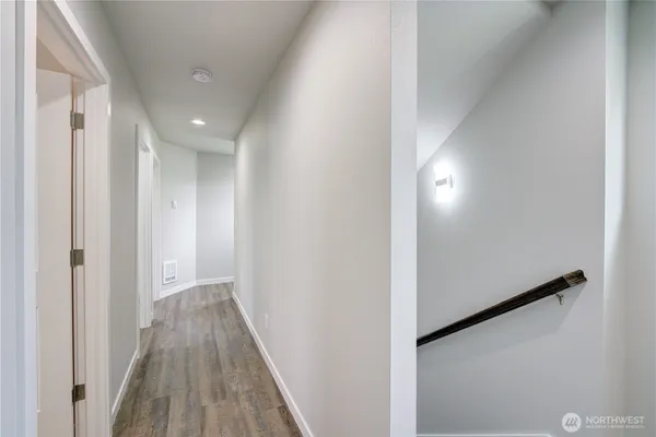 a large bed in a bedroom next to a window