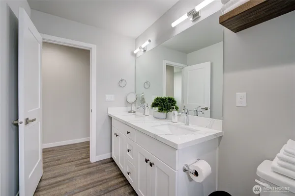 a bedroom with two beds and a window