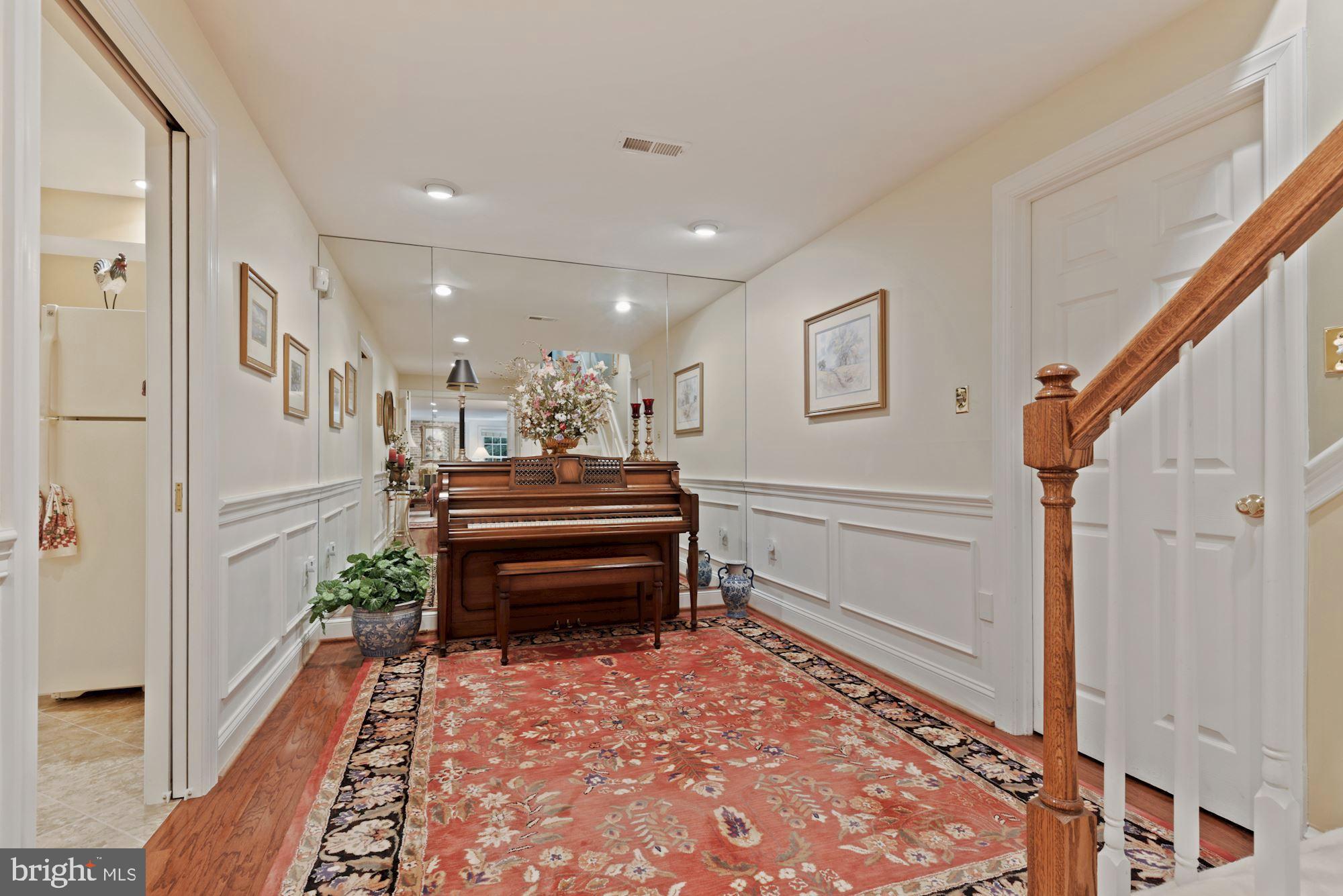 1138 Round Pebble Lane Reston, VA 20194 - Photo 25 of 55 Piano Alcove w/door to storage at base of stairs