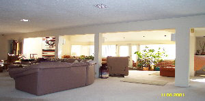10076 Fish Hatchery Road Winnebago, IL 61088 - Photo 3 of 4 a living room with furniture and a large window