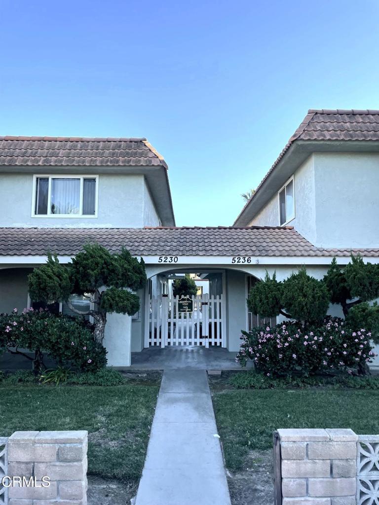 5230 West Wooley Road Oxnard, CA 93035 - Photo 1 of 1 a front view of a house with a yard