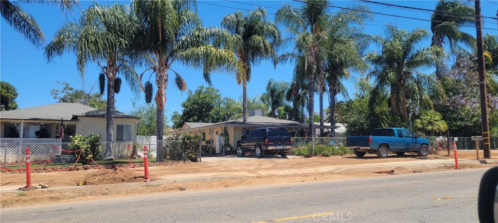 34530 County Line Road Yucaipa, CA 92399 - Photo 1 of 1 a view of a house with a yard and palm trees