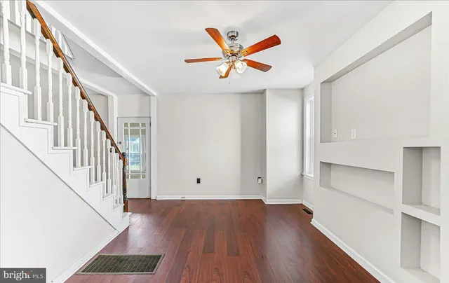 a view of an entryway with wooden floor