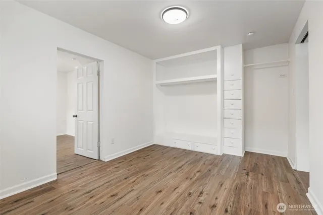 an empty room with wooden floor