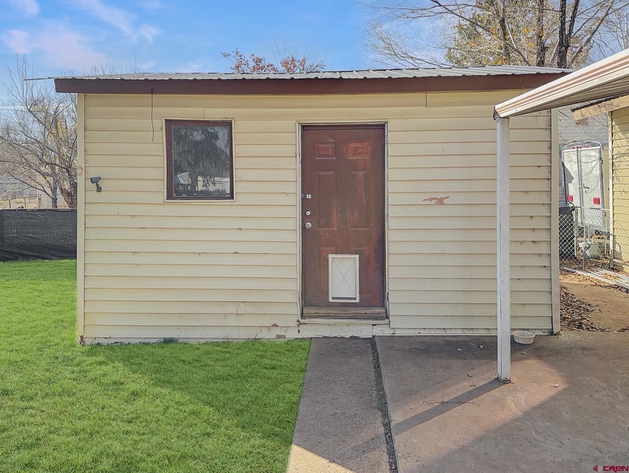 717 East 3rd Street Cortez, CO 81321 - Photo 19 of 26 a view of a house with a yard