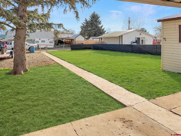 a view of a backyard with a garden