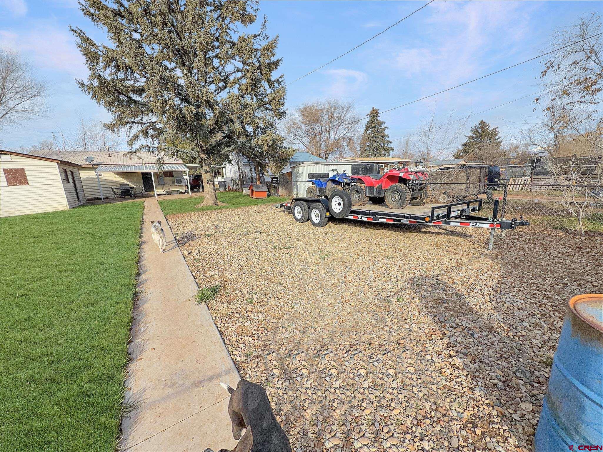 717 East 3rd Street Cortez, CO 81321 - Photo 22 of 26 a view of a park with swings and slides
