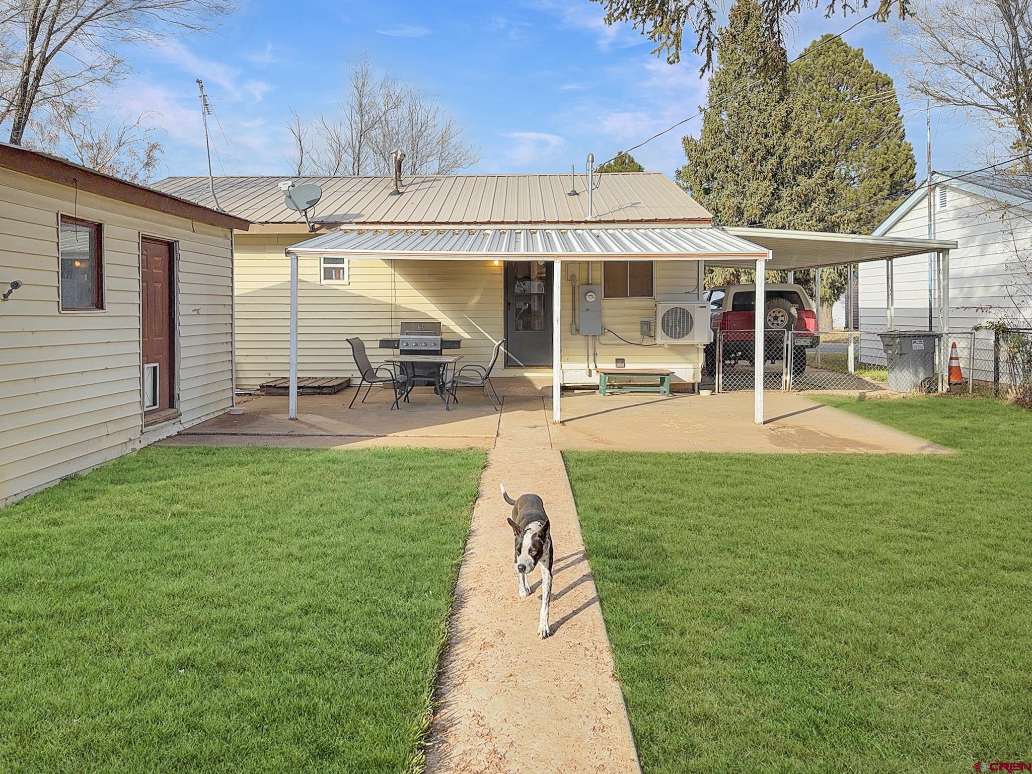 717 East 3rd Street Cortez, CO 81321 - Photo 24 of 26 a view of a house with a yard porch and sitting area