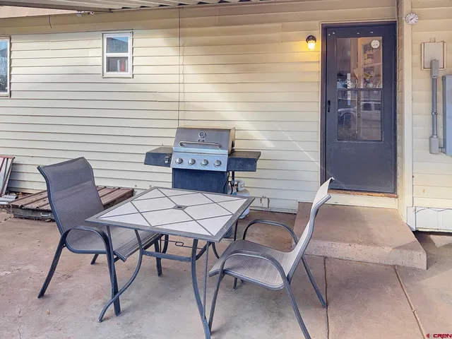 a room with a refrigerator and cabinets