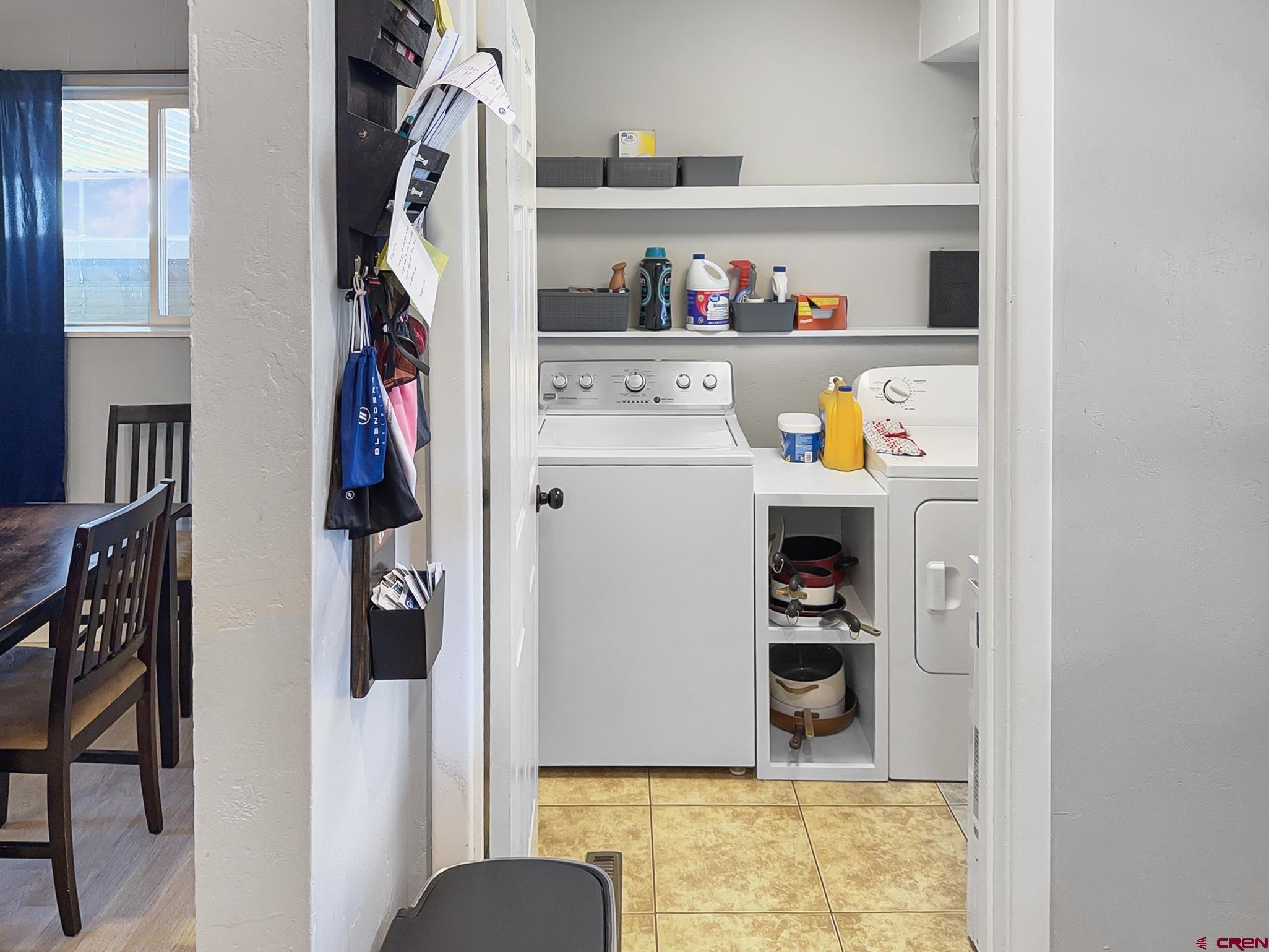 717 East 3rd Street Cortez, CO 81321 - Photo 26 of 26 a room with a refrigerator and cabinets