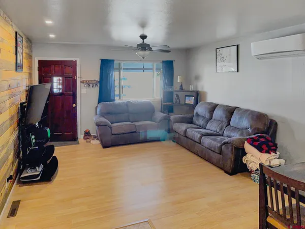 a living room with furniture window and a couch