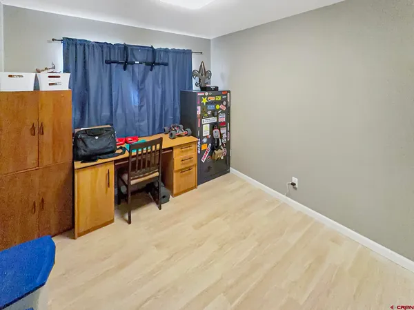 a room with a bed and furniture