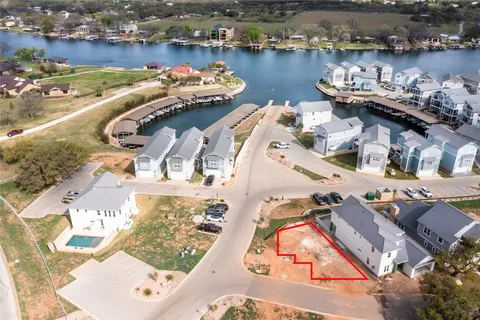 an aerial view of a house with outdoor seating