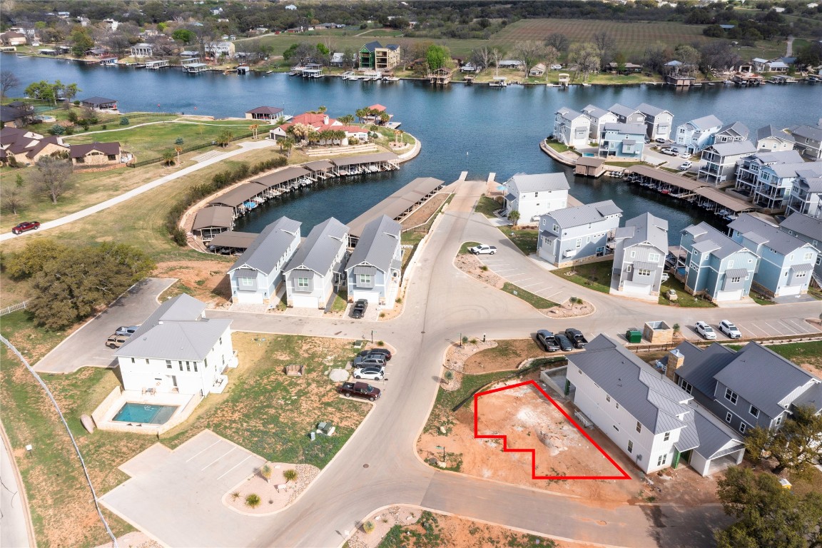 an aerial view of a house with outdoor seating