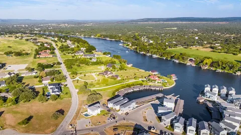 an aerial view of residential house with outdoor space and river