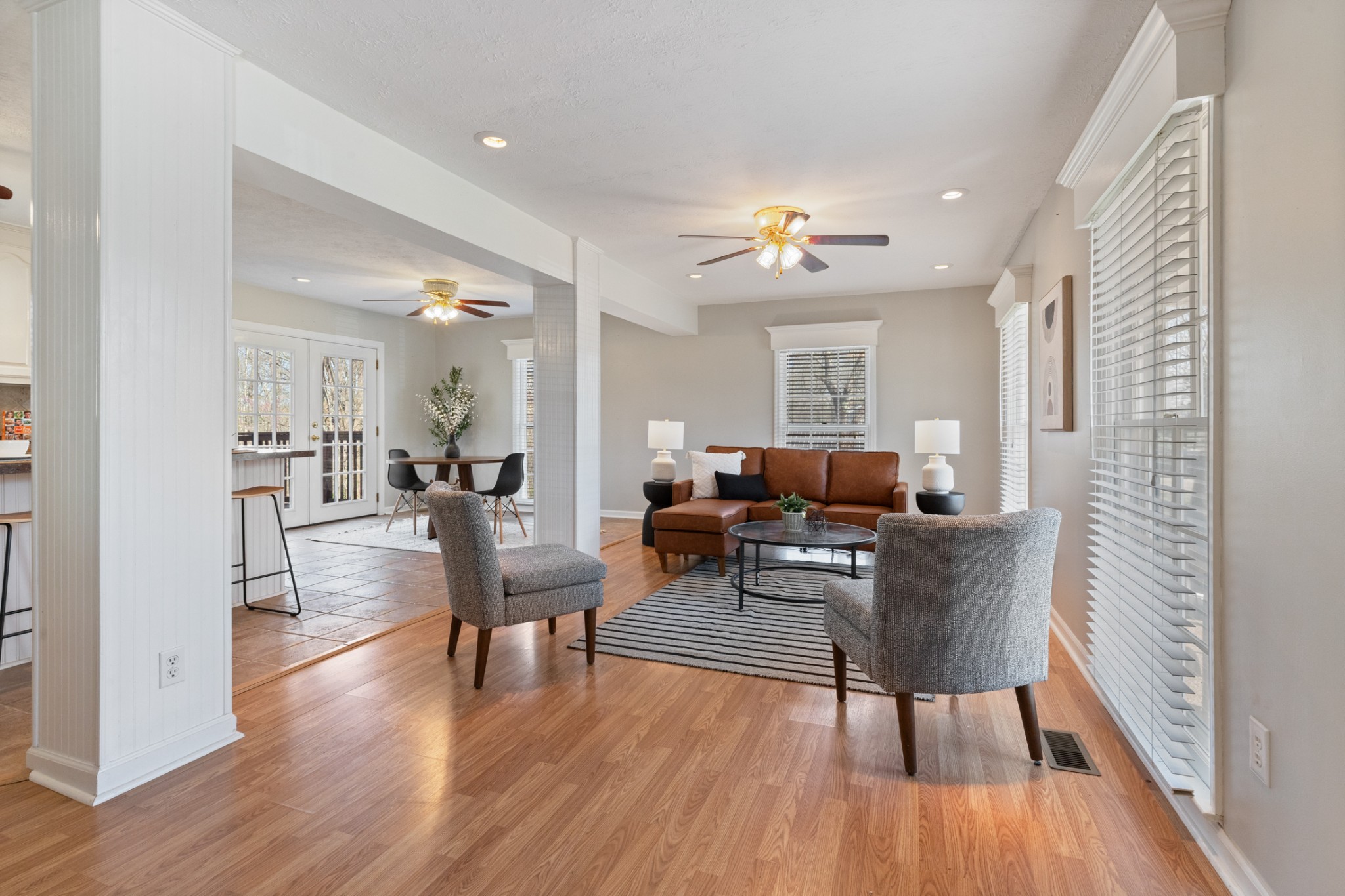 110 Redbud Drive Dickson, TN 37055 - Photo 15 of 43 a living room with furniture a wooden floor and a chandelier