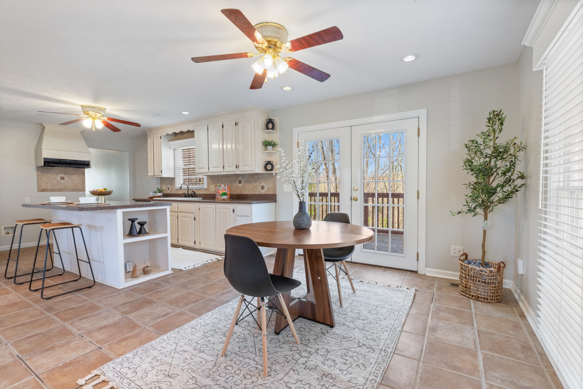 110 Redbud Drive Dickson, TN 37055 - Photo 22 of 43 a view of a dining room with furniture and a potted plant