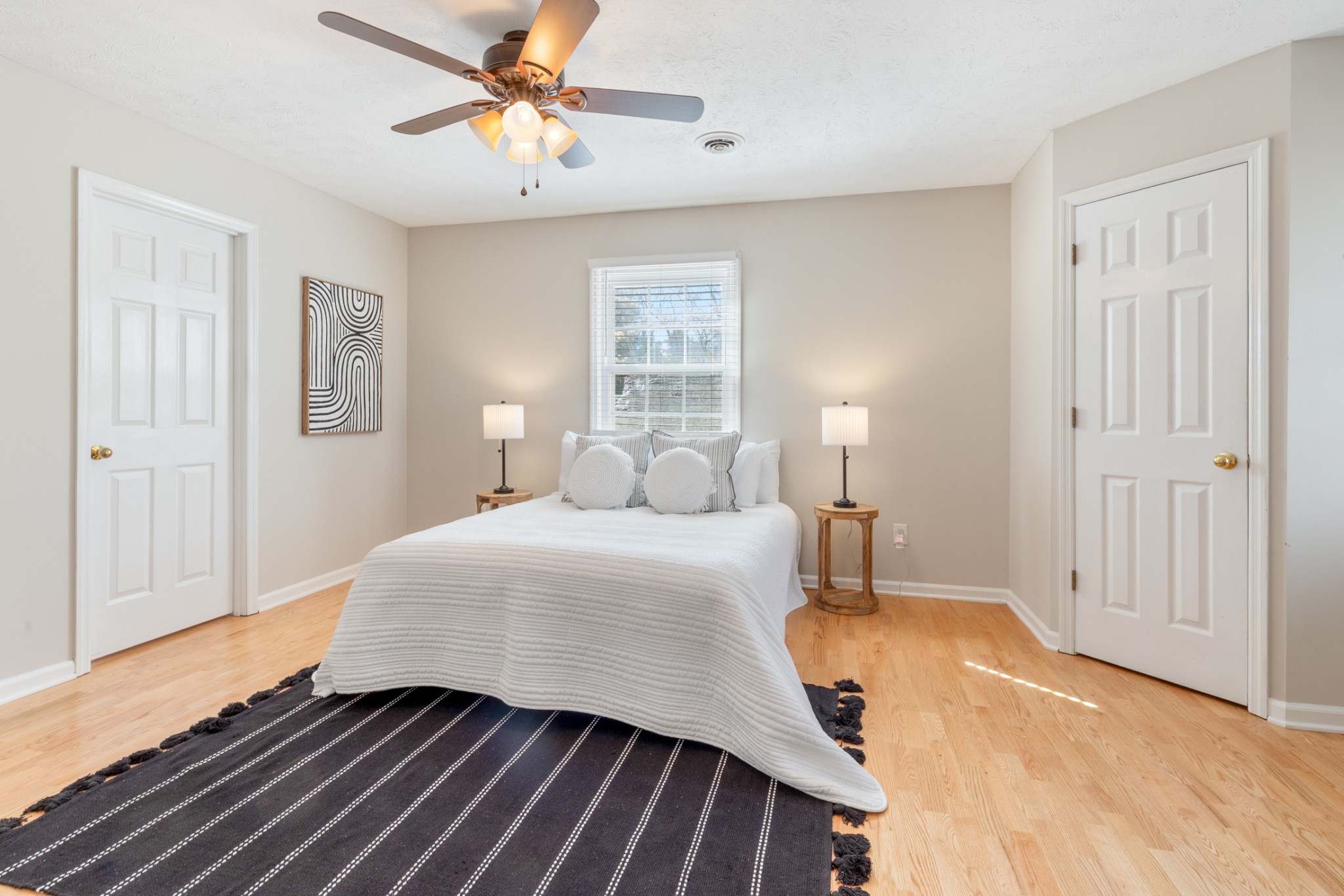 110 Redbud Drive Dickson, TN 37055 - Photo 27 of 43 a bedroom with a bed and a chandelier