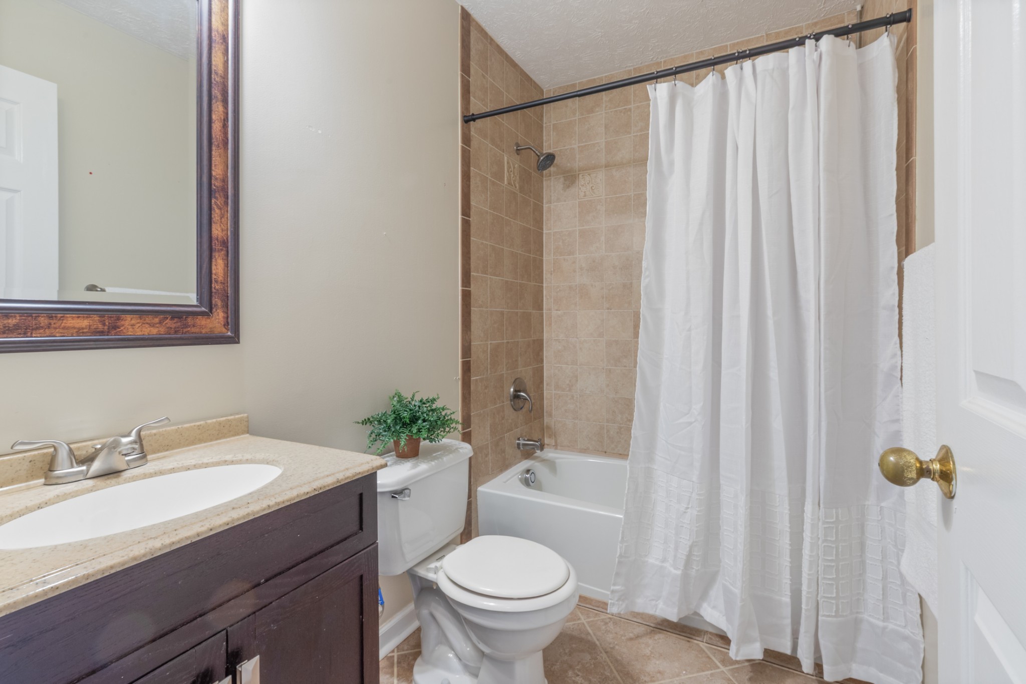 110 Redbud Drive Dickson, TN 37055 - Photo 35 of 43 a bathroom with a granite countertop sink toilet and a mirror