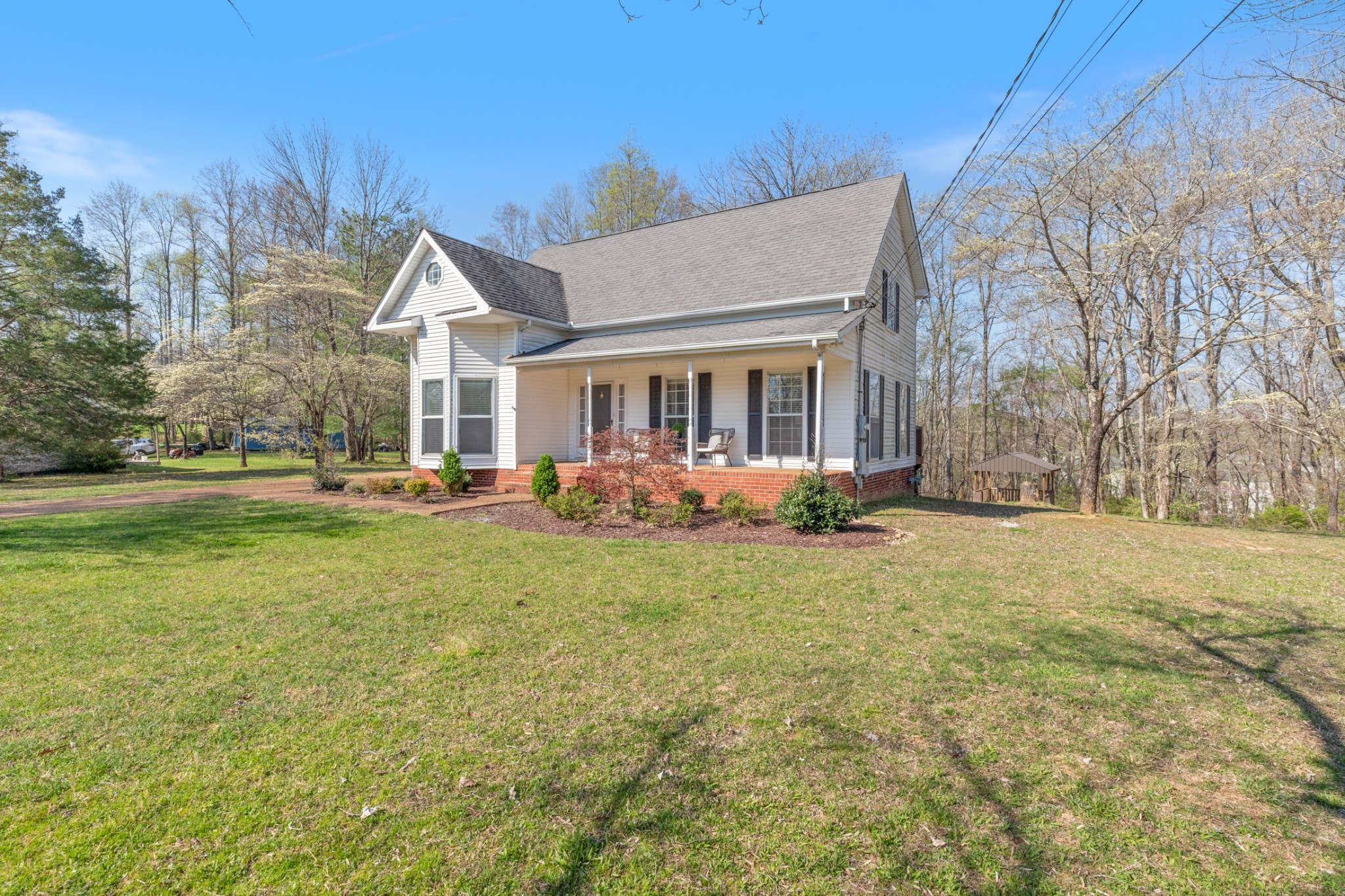 110 Redbud Drive Dickson, TN 37055 - Photo 5 of 43 a front view of house with yard and trees