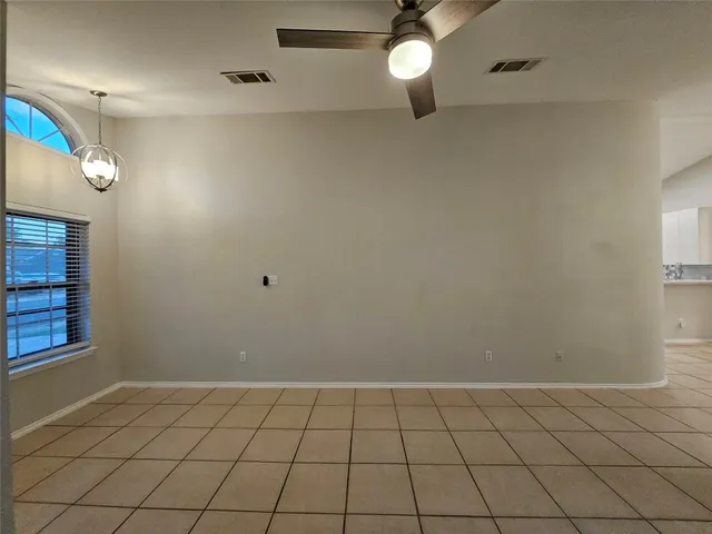 a view of an empty room and window