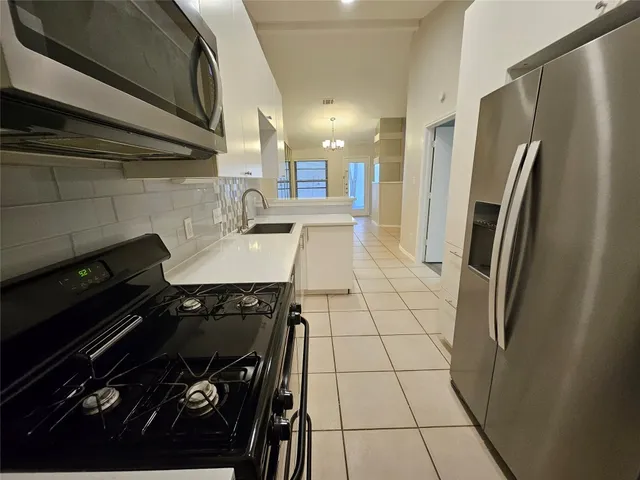 a kitchen with a black appliances